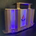 Púlpito de Madeira Samuel, Púlpito de madeira com LED, Púlpito com LED para igrejas, Púlpito moderno de madeira, Púlpito para altar com LED RGB, Púlpito com logo personalizado grátis, Púlpito para igrejas evangélicas, Púlpito de madeira com iluminação, Púlpito para altar com LED decorativo, Púlpito evangélico com logo grátis, Púlpito moderno para igrejas evangélicas, Púlpito de madeira com LED para igrejas evangélicas, Púlpito moderno com LED e logomarca personalizada, Púlpito para igreja com LED multicolor grátis, Comprar púlpito de madeira com LED RGB, Púlpito evangélico com logo adesivo personalizado, Púlpito decorativo de madeira para igrejas, Púlpito para altar com iluminação LED grátis, Melhores púlpitos de madeira modernos, Púlpito com LEDs coloridos para ministérios evangélicos, Púlpito para igrejas pequenas ou grandes com LED RGB, Onde comprar púlpito de madeira com LED grátis para igrejas, Púlpito com logomarca personalizada para altar evangélico, Púlpito moderno com iluminação LED RGB para decoração de igrejas, Púlpito de madeira com LED e logo Jesus grátis, Melhor púlpito decorativo para altar com luzes coloridas, Púlpito evangélico com logomarca em adesivo grátis, Púlpito com iluminação LED e base de madeira robusta, Ofertas de púlpitos personalizados com LED RGB, Púlpito para altar evangélico com logo adesiva e LED grátis, Púlpito para igrejas pequenas com LED RGB decorativo, Púlpito para igreja evangélica com LED RGB, Púlpito decorativo para pastores evangélicos, Púlpito de madeira moderno para cultos, Púlpito para altar com LEDs para igrejas evangélicas, Púlpito com iluminação cristã para altar de igreja, Melhor púlpito moderno para igrejas pentecostais, Púlpito decorativo para ministérios religiosos, Púlpito de madeira com iluminação para igrejas evangélicas, Púlpito robusto e decorativo para pastores, Púlpito para altar de pastores com LED RGB, Púlpito com personalização grátis para igrejas, Decoração para altar de pastores com púlpito de madeira, Púlpito para igrejas tradicionais com toque moderno, Púlpito LED RGB grátis para igrejas evangélicas, Púlpito com logomarca adesiva personalizada grátis, Púlpito de madeira com luzes coloridas LED, Púlpito com iluminação LED RGB decorativo para altar, Púlpito de madeira moderno com LED para pastores, Púlpito decorativo com logo adesivo Jesus incluso, Púlpito estilo clássico com LED RGB grátis, Púlpito de madeira iluminado para cultos evangélicos, Púlpito decorativo com logo cristã personalizável grátis, Púlpito com luzes RGB e madeira resistente para igrejas, Púlpito com LED para igrejas em São Paulo, Comprar púlpito de madeira em Minas Gerais, Púlpito evangélico com logo grátis em Goiás, Púlpito moderno com luzes em Brasília, Púlpito personalizado para altar no Rio de Janeiro, Púlpito decorativo para ministérios evangélicos na Bahia, Púlpito LED grátis para igrejas no Paraná, Púlpito de Madeira com LED RGB e Logo Grátis Modernize sua igreja hoje, Personalize o altar da sua igreja com púlpitos modernos Confira, Púlpito com LED e logomarca adesiva para igrejas evangélicas. Frete rápido, Decore com estilo: Púlpito de madeira com LEDs coloridos Compre agora